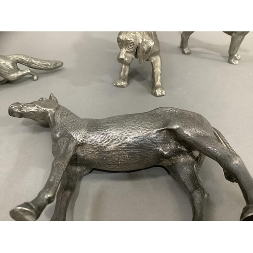 99 - A silver plated hunting group of horse, a small hunting dog, two further hunting dogs and a fox