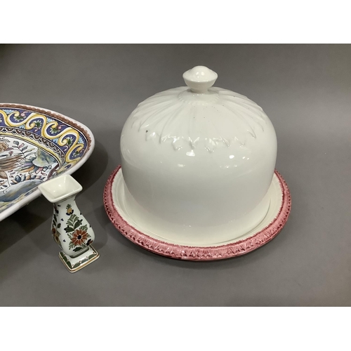 79 - A Blakeney cream and pink cheese bell and cover 20cm high, a Portugese faience plate brightly enamel... 