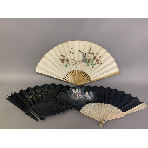 21 - Three fans from the 1890’s: a large wood fan with cream cotton leaf, painted with Pierrot kneeling o... 