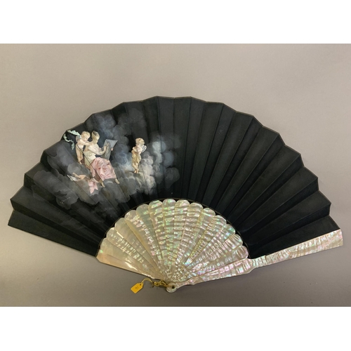 21 - Three fans from the 1890’s: a large wood fan with cream cotton leaf, painted with Pierrot kneeling o... 