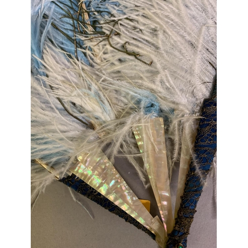 81 - Four feather fans: the first of unusual construction, having gorge sticks of pink mother of pearl an... 