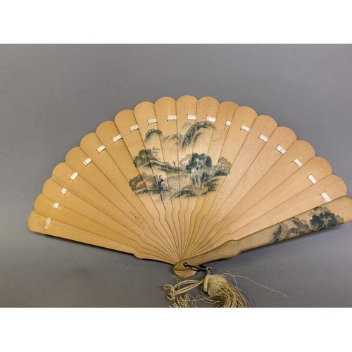 119 - Four oriental fans: a 19th century Japanese wood brisé the 18 inner sticks and two guards with round... 