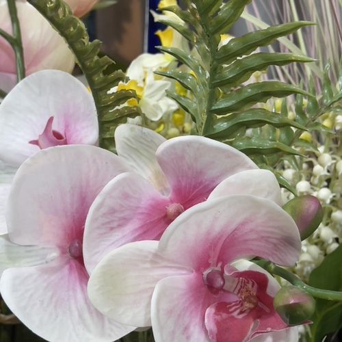 118 - A quantity of imitation flowers comprising Hydrangea, Daffodils, Narcisi, fruit blossom, Orchids, Ma... 