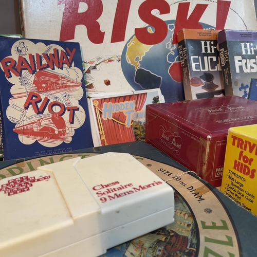 34 - Vintage board games comprising Waddington's circular puzzle, Risk, Trivial Pursuit etc.