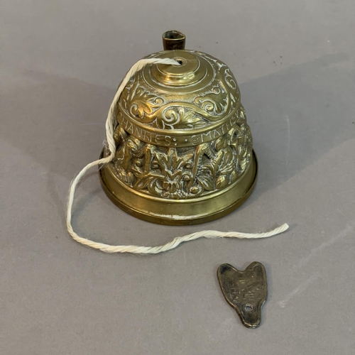 195 - A 20th Century Brass Sanctuary Bell string holder and a Chinese spade coin