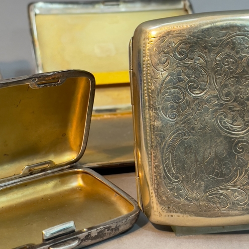 181 - Five early to mid 20th century silver cigarette cases together with one silver plated cigarette case... 