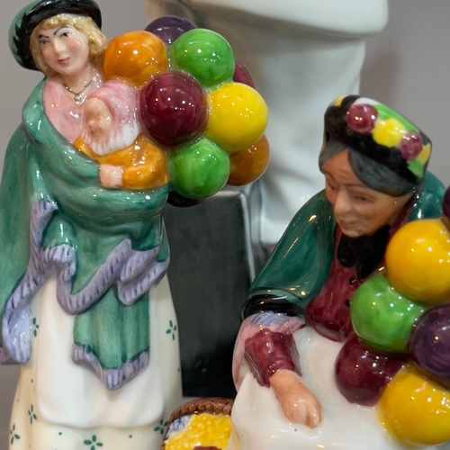 75 - A Royal Doulton figure 'Balloon Clown' 24cm, 'The Old Balloon Seller' 8cm high, 'The Balloon Seller'... 