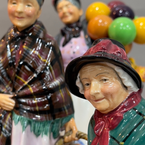 56 - A Royal Doulton 'The Old Balloon Seller' 23cm high, 'The Orange Lady' 22cm high, 'Silks and Ribbons'... 