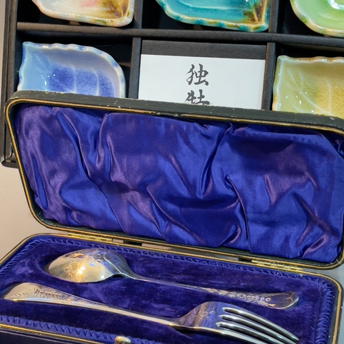 68 - A Royal Worcester cake slice, five Japanese ceramic leaf bowls and a silver plated fork and spoon in... 