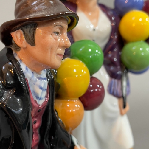 51 - A Royal Doulton figure 'Balloon Lady' 21cm high and 'The Balloon Man' 19cm high