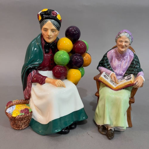 52 - A Royal Doulton ' The Old Balloon Seller' 18cm high and 'The Family Album' figures