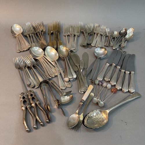 78 - A collection of silver plated and stainless steel cutlery comprising forks, soup spoons, serving spo... 