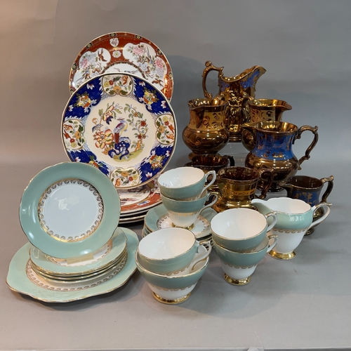 104 - Seven copper lustreware jugs and a Royal Sutherland duck egg and gilt tea service for five and six c... 