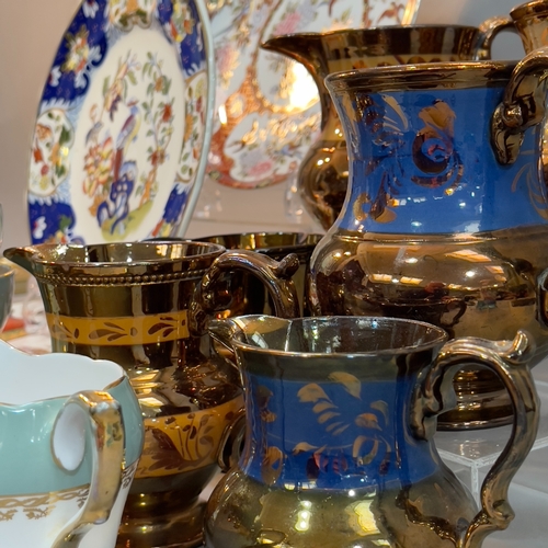 104 - Seven copper lustreware jugs and a Royal Sutherland duck egg and gilt tea service for five and six c... 