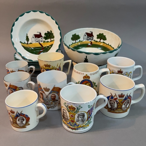 87 - Six Dartmoor ware bowls hand painted with landscape and house together with a pedestal bowl on foot,... 