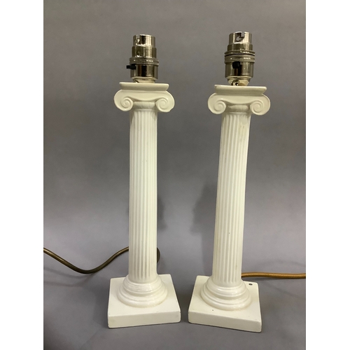 126 - Two cream ceramic table lamps formed as colums on stepped bases