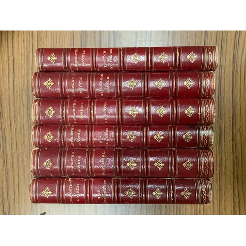 59 - Uniform bound set of Ainsworth's Novels in scarlet Morocco half calf binding with marbled boards and... 