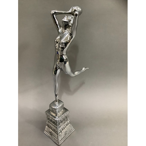 67 - An Art Deco style chrome figure of girl with ball on moulded base, 43cm high