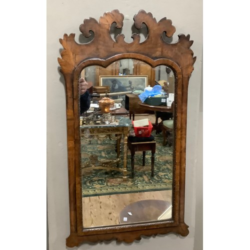 134 - A George III walnut figured wall mirror, with fretwork frame, later glass, 77cm x 44cm