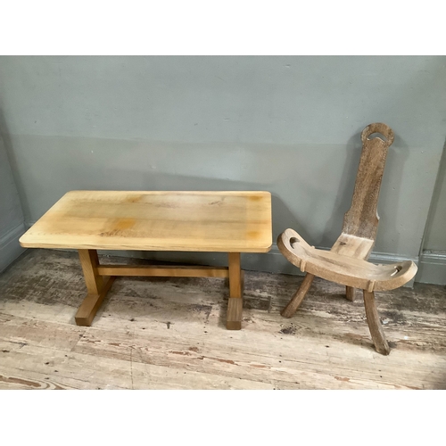 238 - A bleached oak coffee table with stretcher on twin supports, 90cm wide together with a carved beech ... 