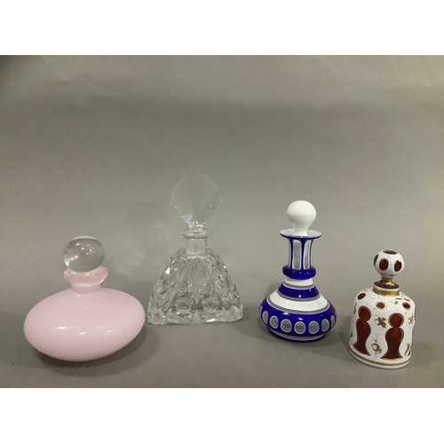 18 - Several 19th/20th century glass scent bottles, including a cranberry and white overlay