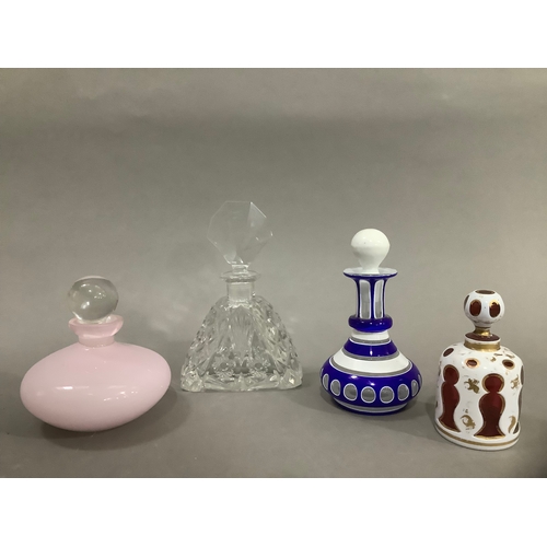 18 - Several 19th/20th century glass scent bottles, including a cranberry and white overlay