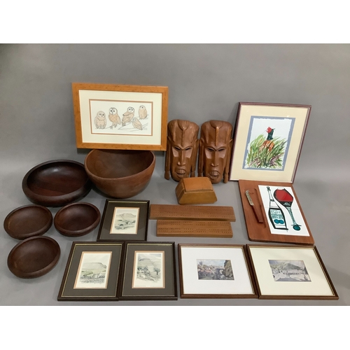 114 - A collection of carved bowls, a tribal mask and a collection of pictures