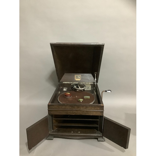 132 - A His Masters Voice portable record player, with tin of needles