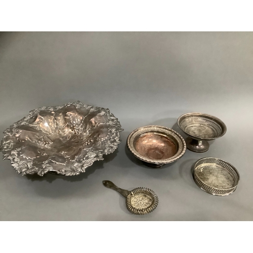 150 - A silver plate on copper fruit dish moulded with vine leaves and grapes 35cm diameter on single foot... 