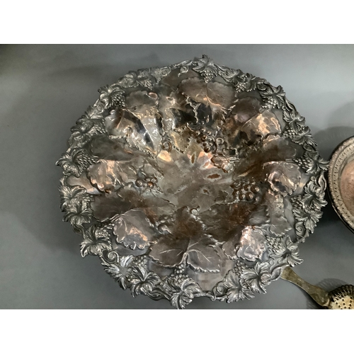 150 - A silver plate on copper fruit dish moulded with vine leaves and grapes 35cm diameter on single foot... 