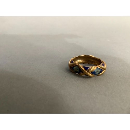 201 - An enamel band ring (at fault) in yellow metal (tests as 14ct gold), approximate weight 6g