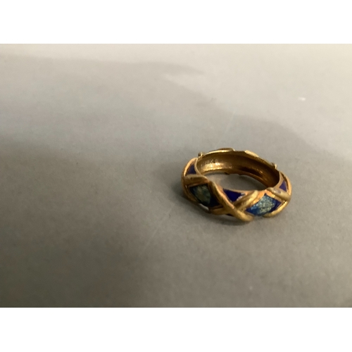 201 - An enamel band ring (at fault) in yellow metal (tests as 14ct gold), approximate weight 6g