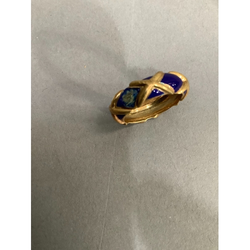 201 - An enamel band ring (at fault) in yellow metal (tests as 14ct gold), approximate weight 6g