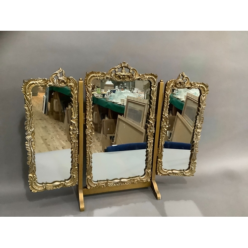 243 - Gilt three fold mirror having foliate and rocaille frame, 59cm