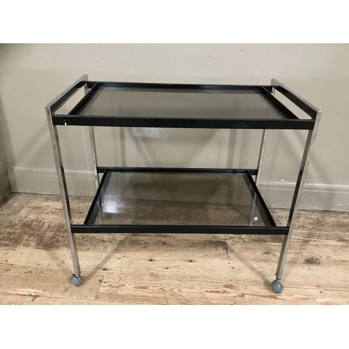 216 - Two tier chrome and smoked glass drinks trolley on castors