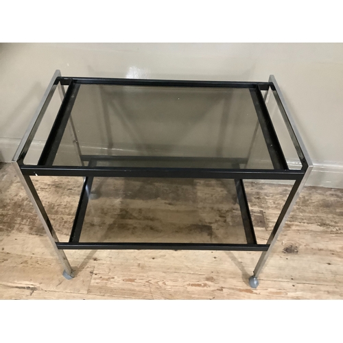 216 - Two tier chrome and smoked glass drinks trolley on castors