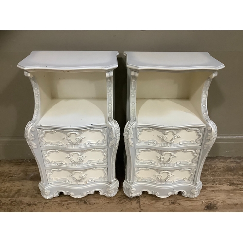 231 - A pair of French style grey painted bedside cabinets, serpentine fronted having an open compartment ... 