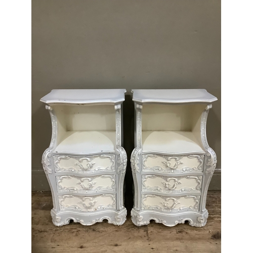 231 - A pair of French style grey painted bedside cabinets, serpentine fronted having an open compartment ... 