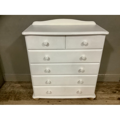 236 - A modern off white chest of drawers having a short raised back above two short and four long drawers... 