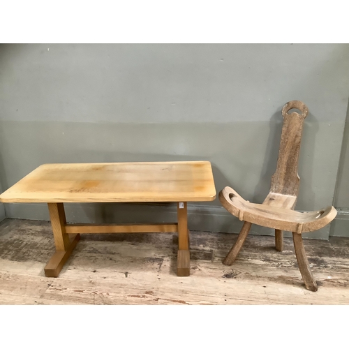 238 - A bleached oak coffee table with stretcher on twin supports, 90cm wide together with a carved beech ... 