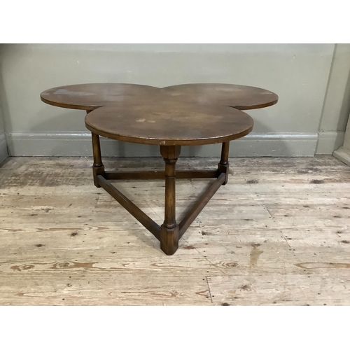 252 - An oak occasional table of club shape, ring turned legs on triangular framing