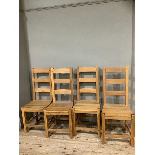 254 - A set of four hardwood ladder back chairs