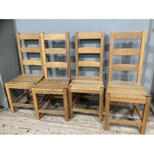 254 - A set of four hardwood ladder back chairs