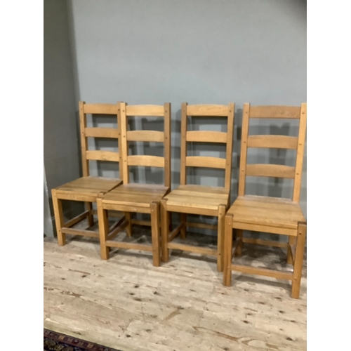 254 - A set of four hardwood ladder back chairs