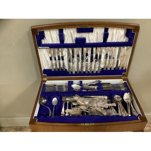 258 - A walnut table canteen containing associated sets of kings pattern EPNS cutlery