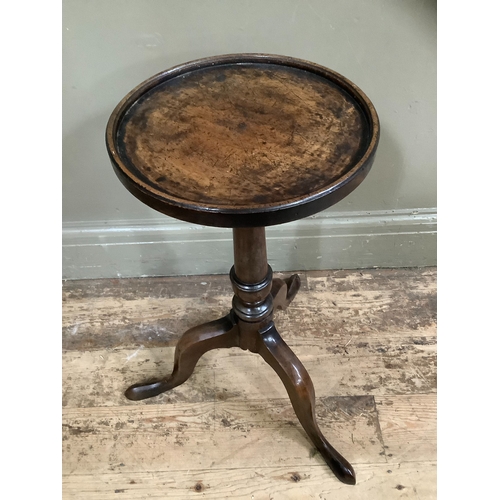 259 - An 18th century style mahogany wine table with dished top, vase turned pedestal, on three cabriole l... 