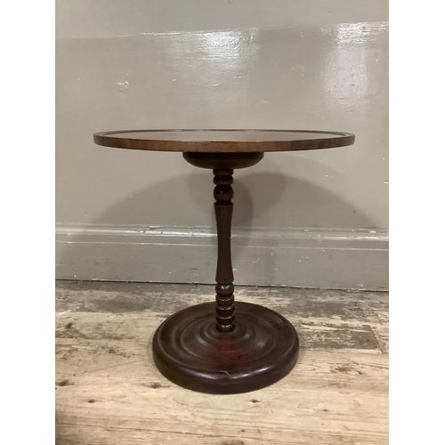 261 - A mahogany occasional table on dished base, 40cm high