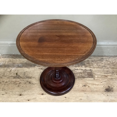 261 - A mahogany occasional table on dished base, 40cm high