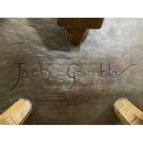 263 - Jack Grimble of Cromer, an oak spinning chair carved to the back with a rose, having a pippy oak sea... 