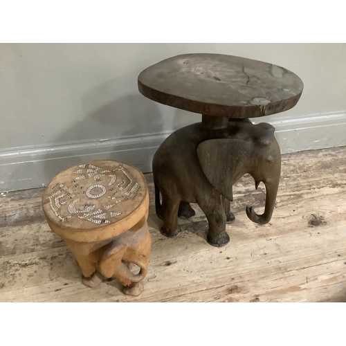 264 - An African hardwood stool, the support carved as an elephant together with a smaller example, the se... 